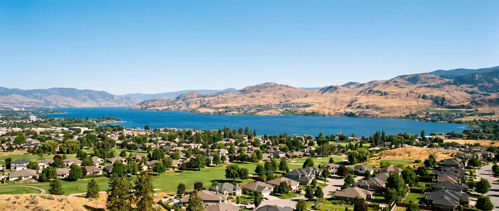 Illustration of Kelowna's lakefront and benchland neighbourhoods rising from Okanagan Lake